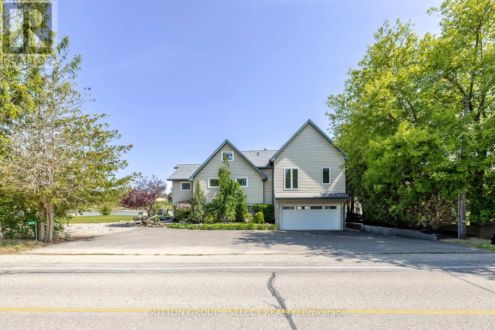 7474 Riverside Drive, Lambton Shores (Port Franks), ON - Outdoor With Facade