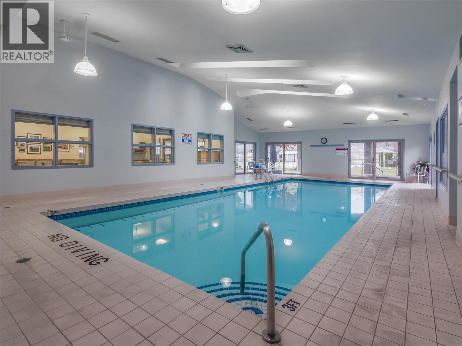 3333 South Main Street Unit# 143, Penticton, BC - Indoor Photo Showing Other Room With In Ground Pool