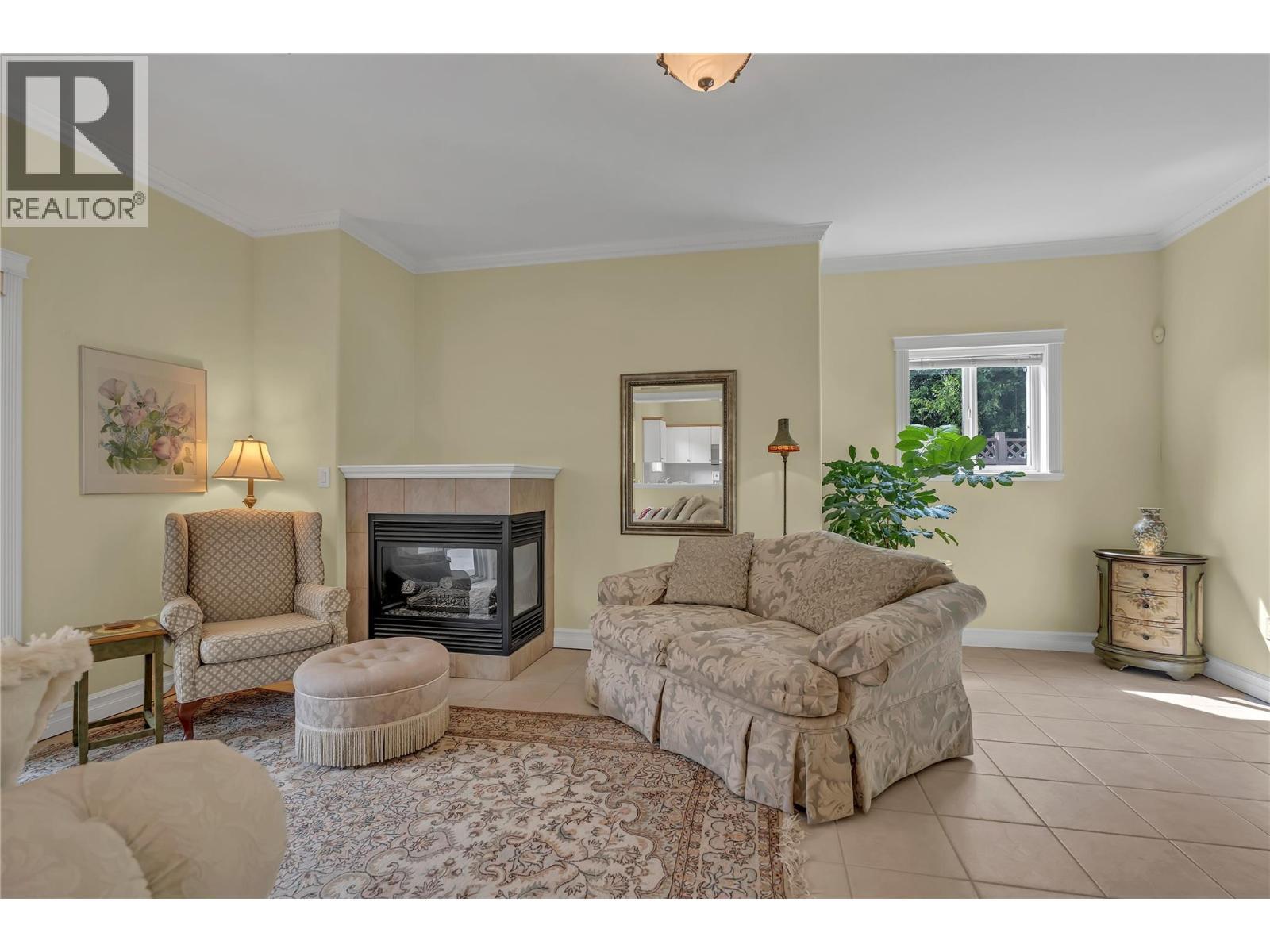 1078 Burnaby Avenue Unit# 105, Penticton, BC - Indoor Photo Showing Living Room With Fireplace