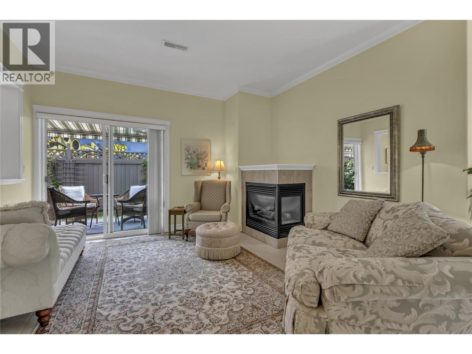 1078 Burnaby Avenue Unit# 105, Penticton, BC - Indoor Photo Showing Living Room With Fireplace