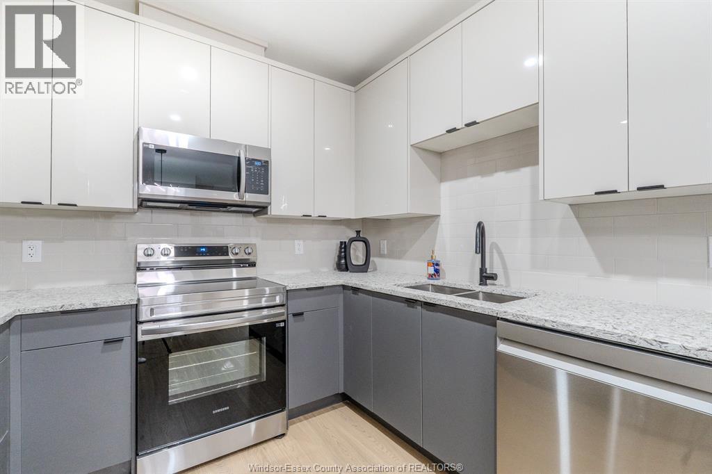 705 Grand Marais Unit# 204, Windsor, ON - Indoor Photo Showing Kitchen With Double Sink
