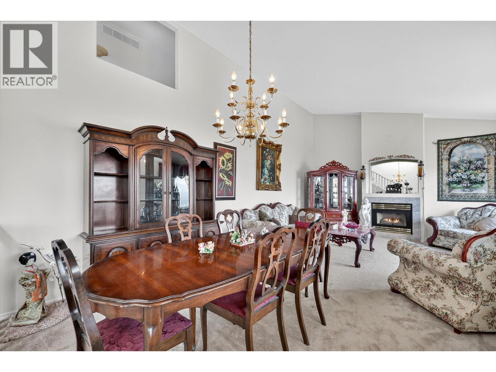 5220 Sutherland Road, Peachland, BC - Indoor Photo Showing Dining Room With Fireplace