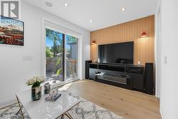 Family Room with Electric Fireplace & W/O to Deck -