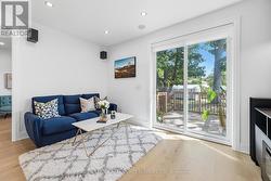 Family Room with a Sliding Door Walkout to Deck -