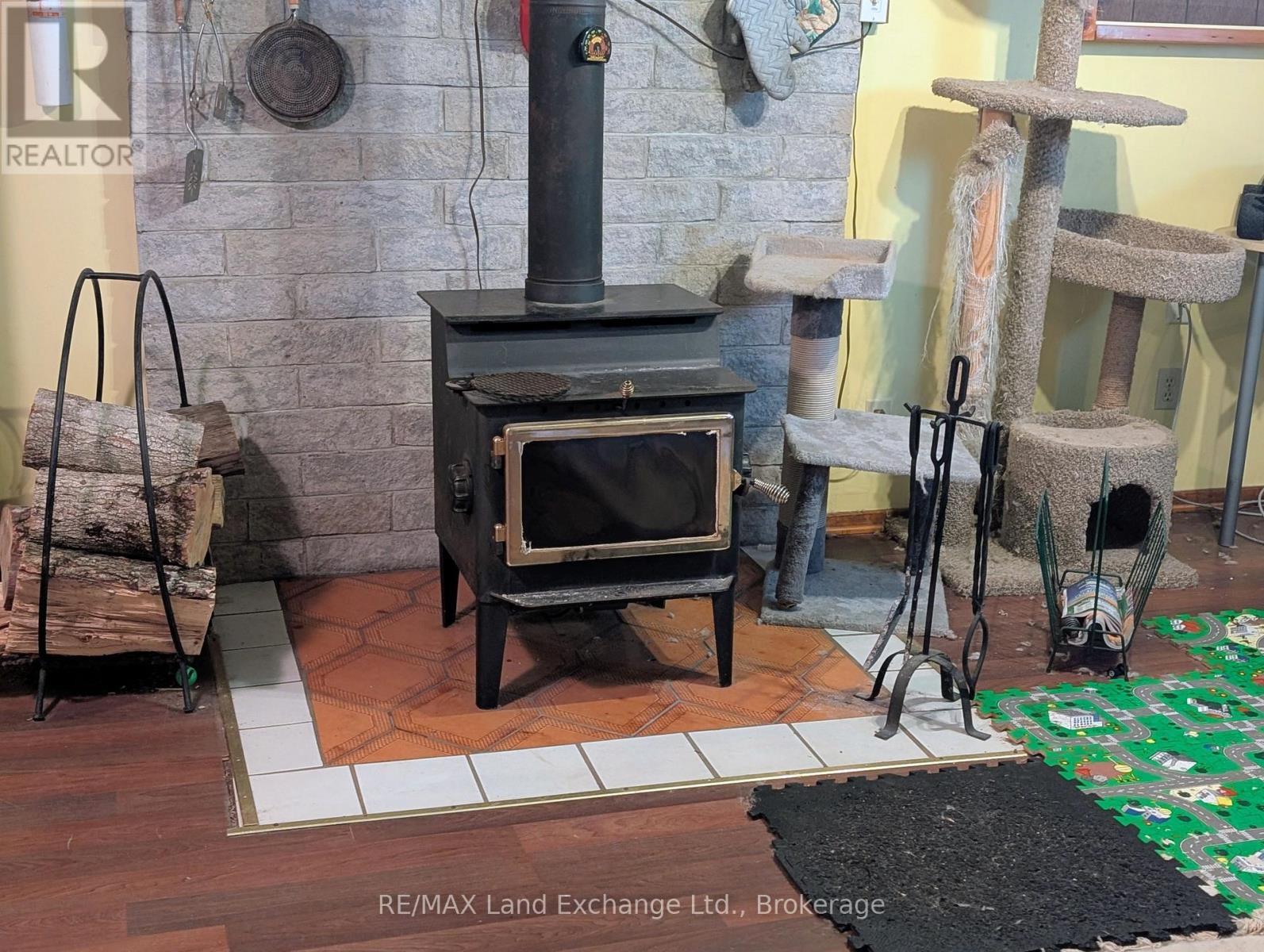woodstove granny flat - 315045 Highway 6 Rr1 Highway, West Grey, ON - Photo Showing Other Room