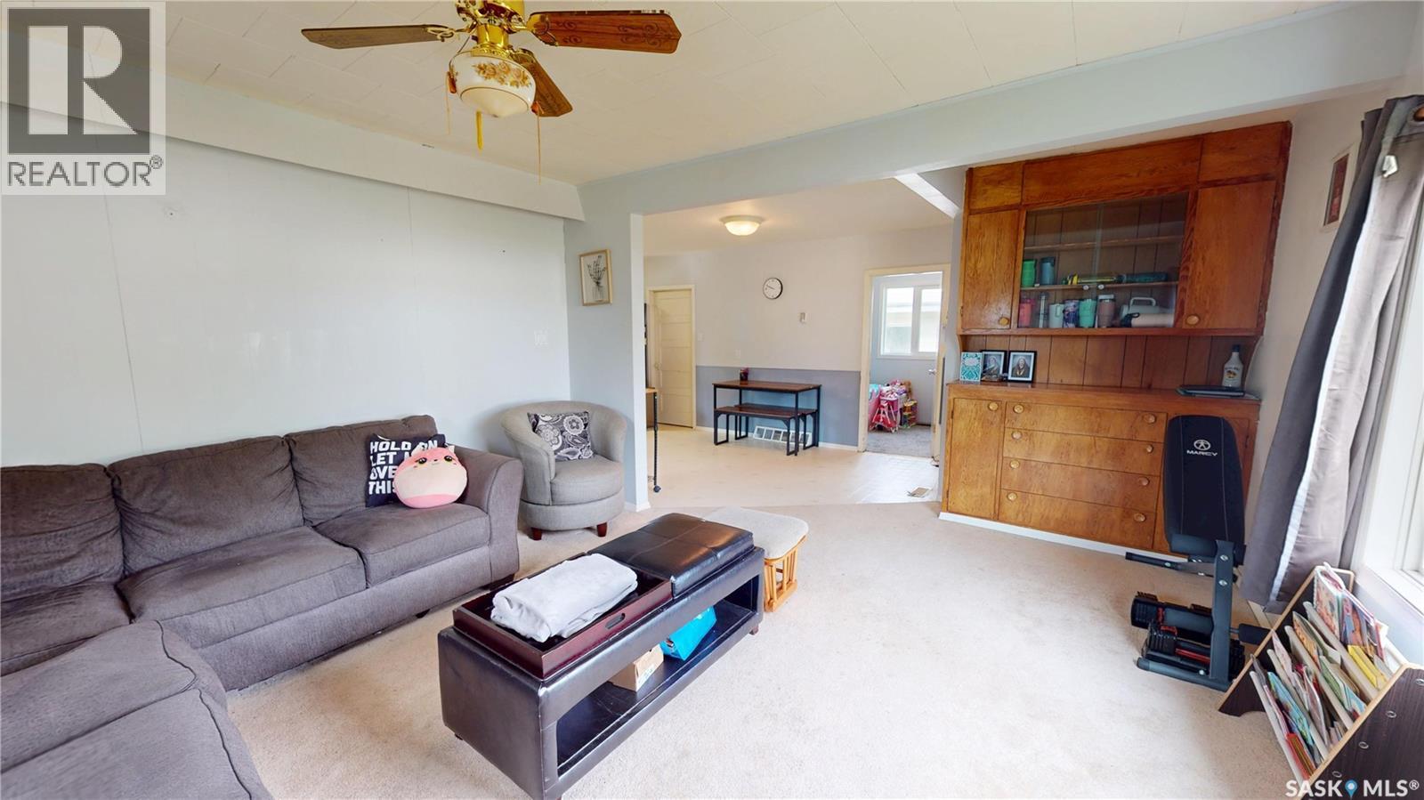230 Railway Avenue W, Wawota, SK - Indoor Photo Showing Living Room With Fireplace