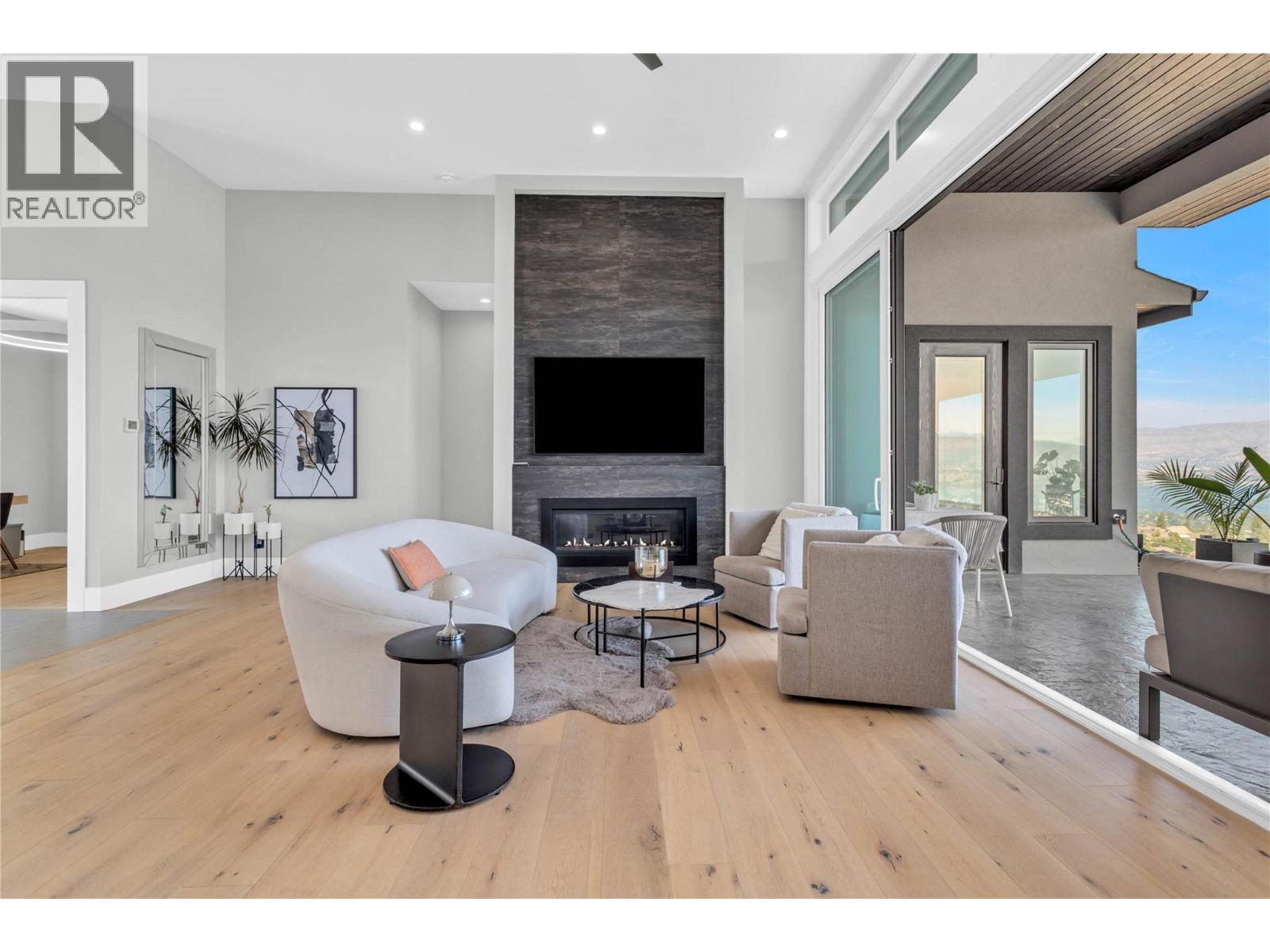 1050 Ledgeview Court, Kelowna, BC - Indoor Photo Showing Living Room With Fireplace