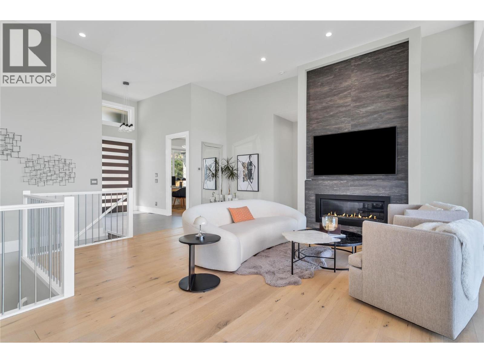 1050 Ledgeview Court, Kelowna, BC - Indoor Photo Showing Living Room With Fireplace