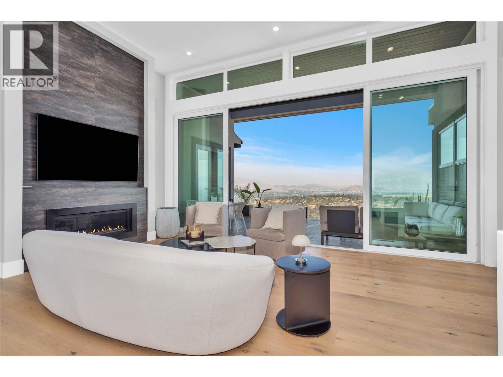 1050 Ledgeview Court, Kelowna, BC - Indoor Photo Showing Other Room With Fireplace