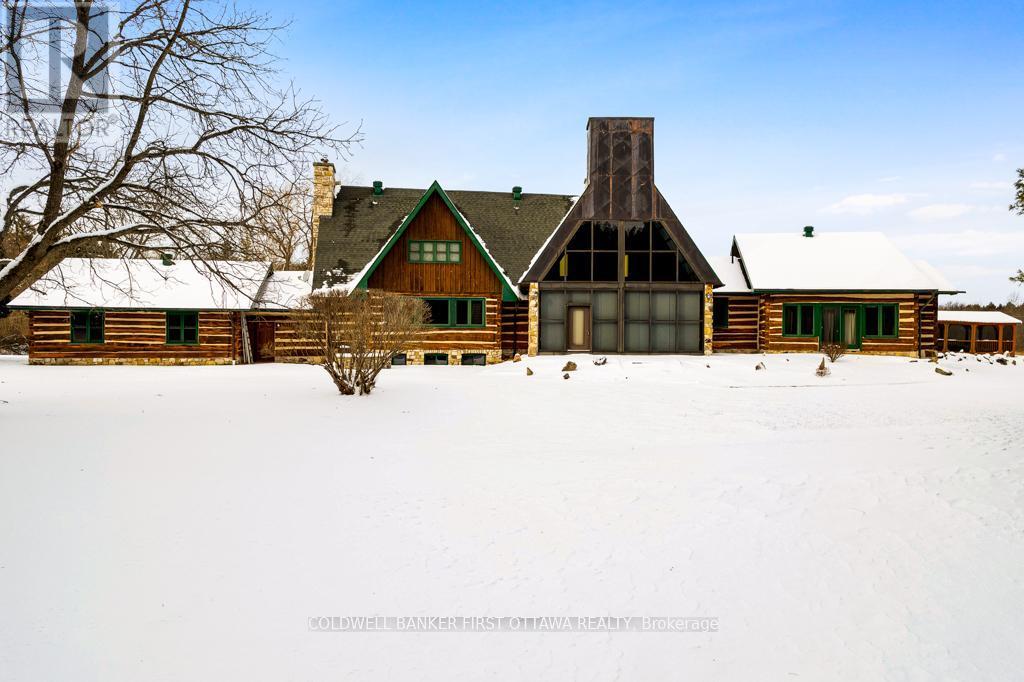 Solarium soaring wall of windows - 2499 Bathurst Concession 2 Road, Tay Valley, ON - Outdoor With Facade