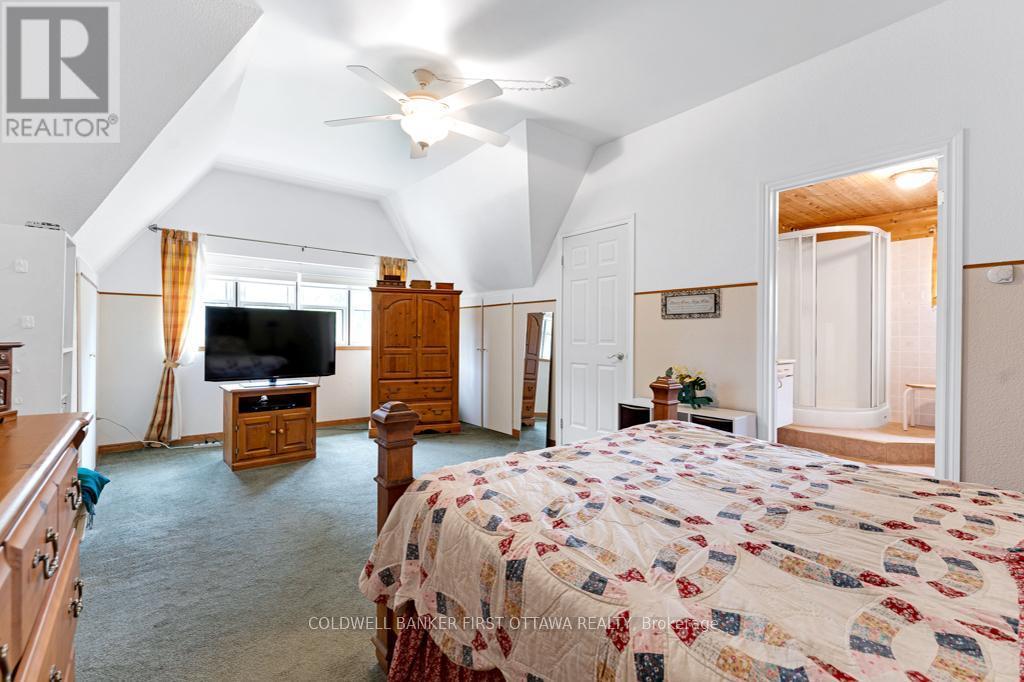 2nd floor primary suite, walk-in closet & ensuite - 2499 Bathurst Concession 2 Road, Tay Valley, ON - Indoor Photo Showing Bedroom