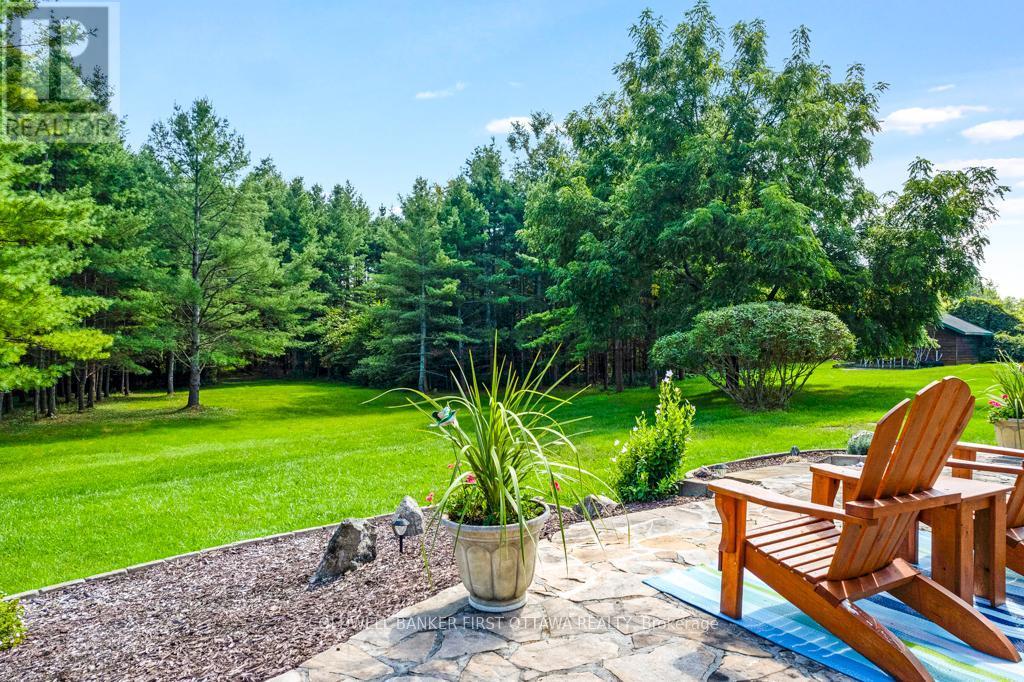 Manicured landscape - 2499 Bathurst Concession 2 Road, Tay Valley, ON - Outdoor With Backyard