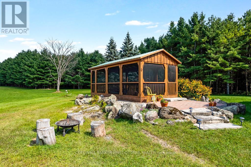 Enclosed gazebo - 2499 Bathurst Concession 2 Road, Tay Valley, ON - Outdoor With Deck Patio Veranda With Backyard