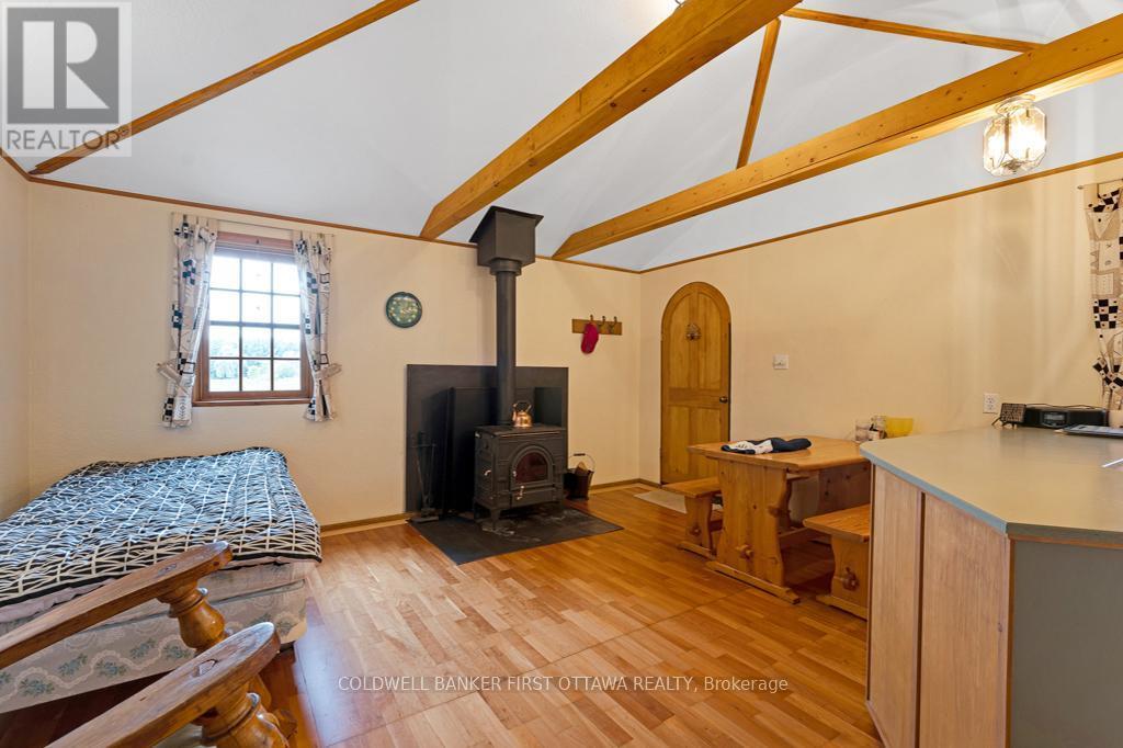 Bunkie with 'hobbit' door and woodstove - 2499 Bathurst Concession 2 Road, Tay Valley, ON - Indoor