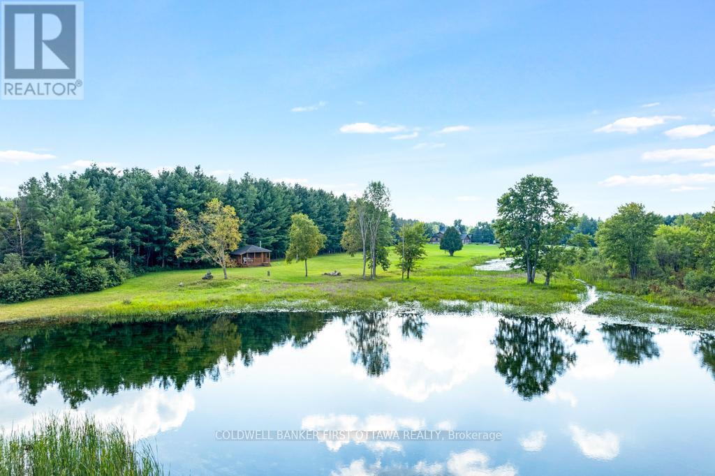 Picturesque Tay River for kayaking and tubing - 2499 Bathurst Concession 2 Road, Tay Valley, ON - Outdoor With Body Of Water With View