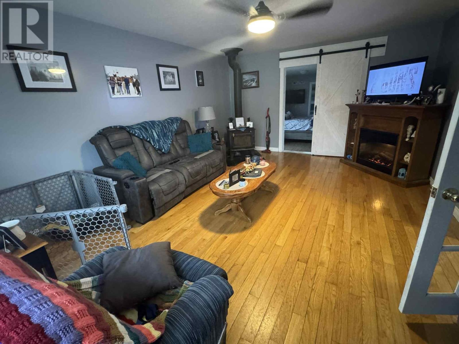 24 Paddon Road, North West River, NL - Indoor Photo Showing Living Room With Fireplace