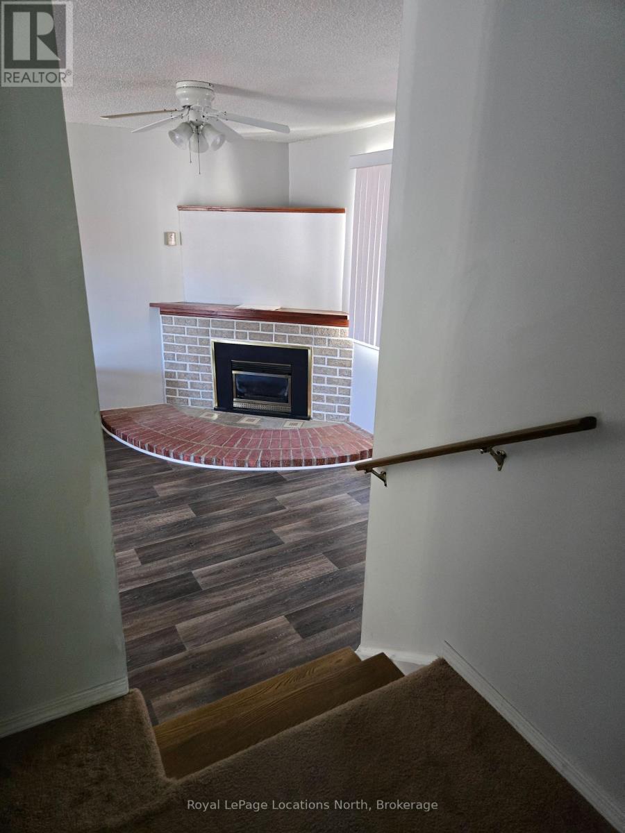 112 Smallman Drive, Wasaga Beach, ON - Indoor Photo Showing Other Room With Fireplace