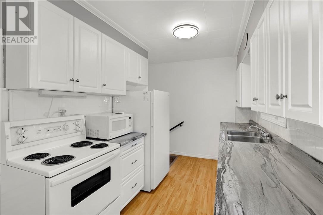 675 Brophy Street, Massey, ON - Indoor Photo Showing Kitchen With Double Sink