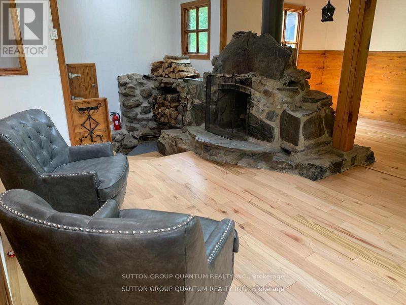 2724 River Road, Frontenac, ON - Indoor Photo Showing Other Room With Fireplace