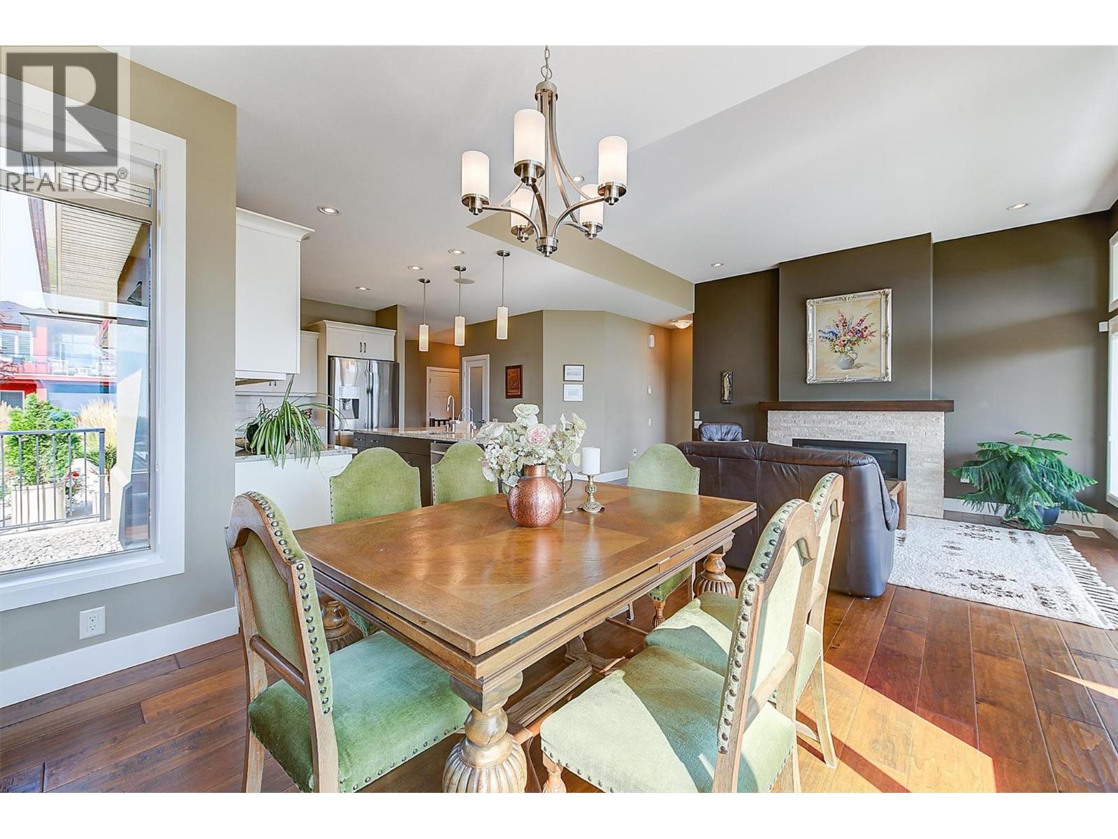 2133 Talavera Place, West Kelowna, BC - Indoor Photo Showing Dining Room With Fireplace