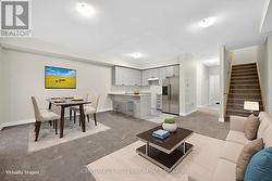 Virtual staged kitchen/dining/living rm. -