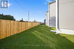 Back yard is sodded & has rear back boundary fence -