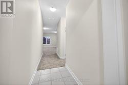 Front foyer leading to main floor dbl closet & 2pc -