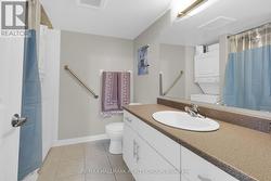 Large full bathroom with plenty of storage. -