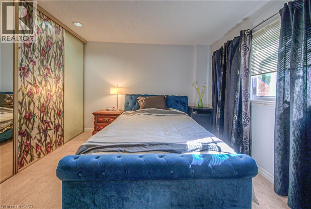 Bedroom with light colored carpet, a closet, and recessed lighting - 310 Christopher Drive Unit# 15, Cambridge, ON - Indoor Photo Showing Bedroom