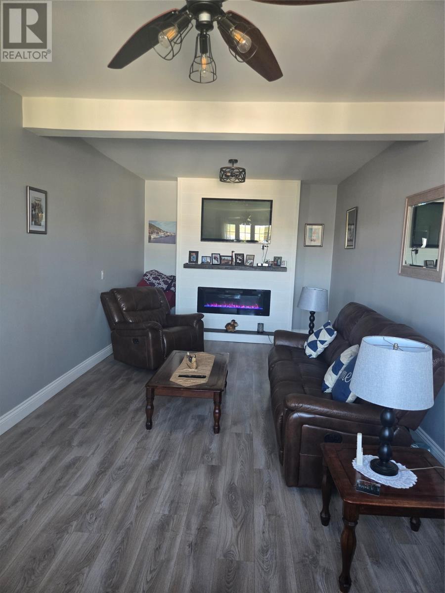 120 Water Street West Street, St. Lawrence, NL - Indoor Photo Showing Other Room With Fireplace