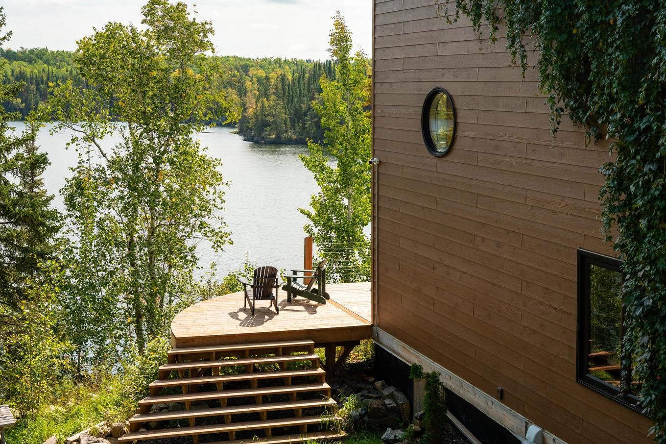 63 S Poplar Bay, District Of Kenora, ON - Outdoor With Body Of Water With Deck Patio Veranda With Exterior