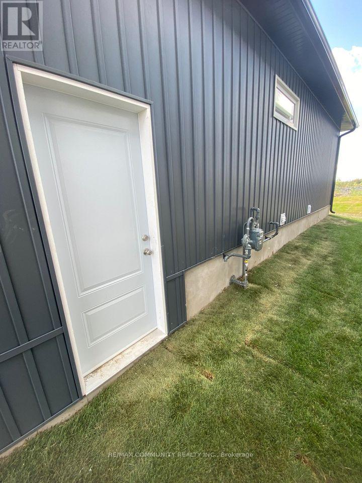 52 Potter Drive, Loyalist, ON - Outdoor With Exterior