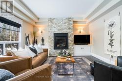 Stone fireplace feature wall with custom built ins -