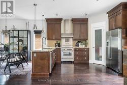 Upgraded kitchen cabinetry to ceiling and pantry -