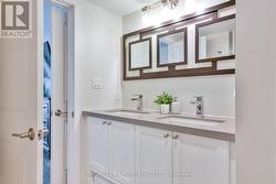 Ensuite with double sinks & tons of storage! -