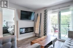 Living rm with a fireplace & walk out with a view! -