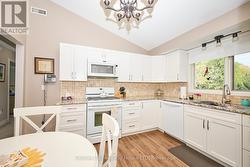 Kitchen overlooking private backyard -