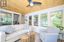 3-Seasons sun room with view of backyard & gardens -