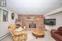 Rec room on the lower level w/ gas fireplace -