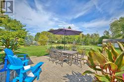 Beautiful back patio surrounded by trees -