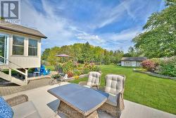The other side of the back patio with dining area -