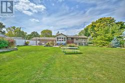 Back view of the house and landscaped yard -