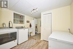 Laundry room with closet & plenty of storage space -