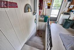 Stairs leading to the basement from laundry room -