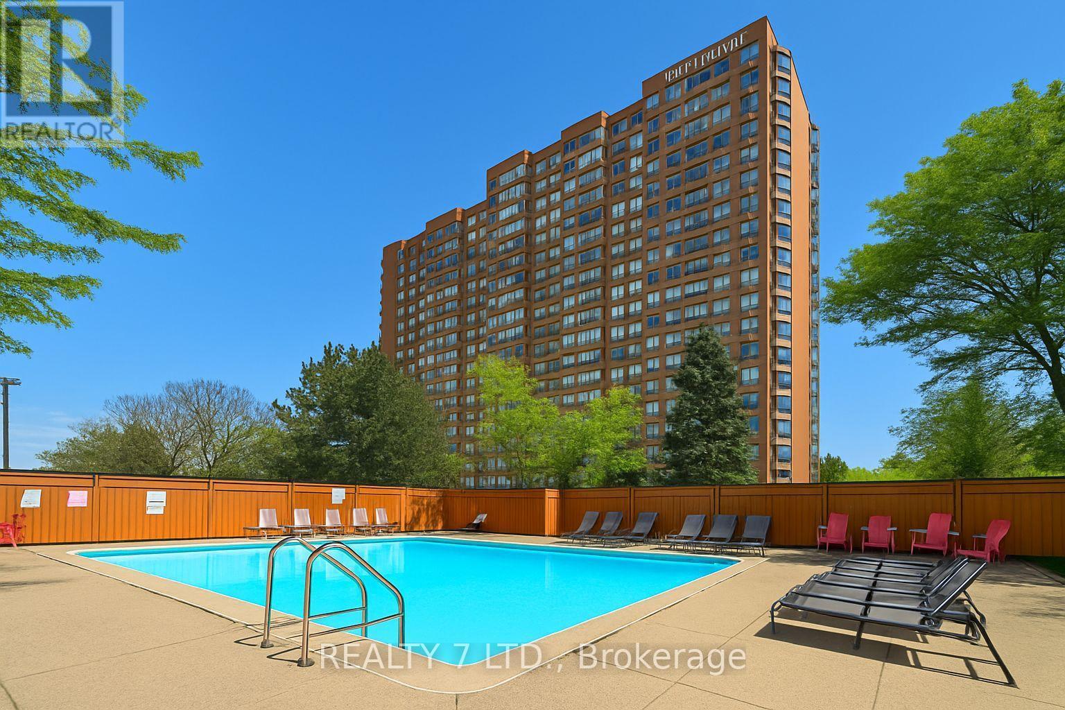 412 - 1270 Maple Crossing Boulevard, Burlington, ON - Outdoor With In Ground Pool