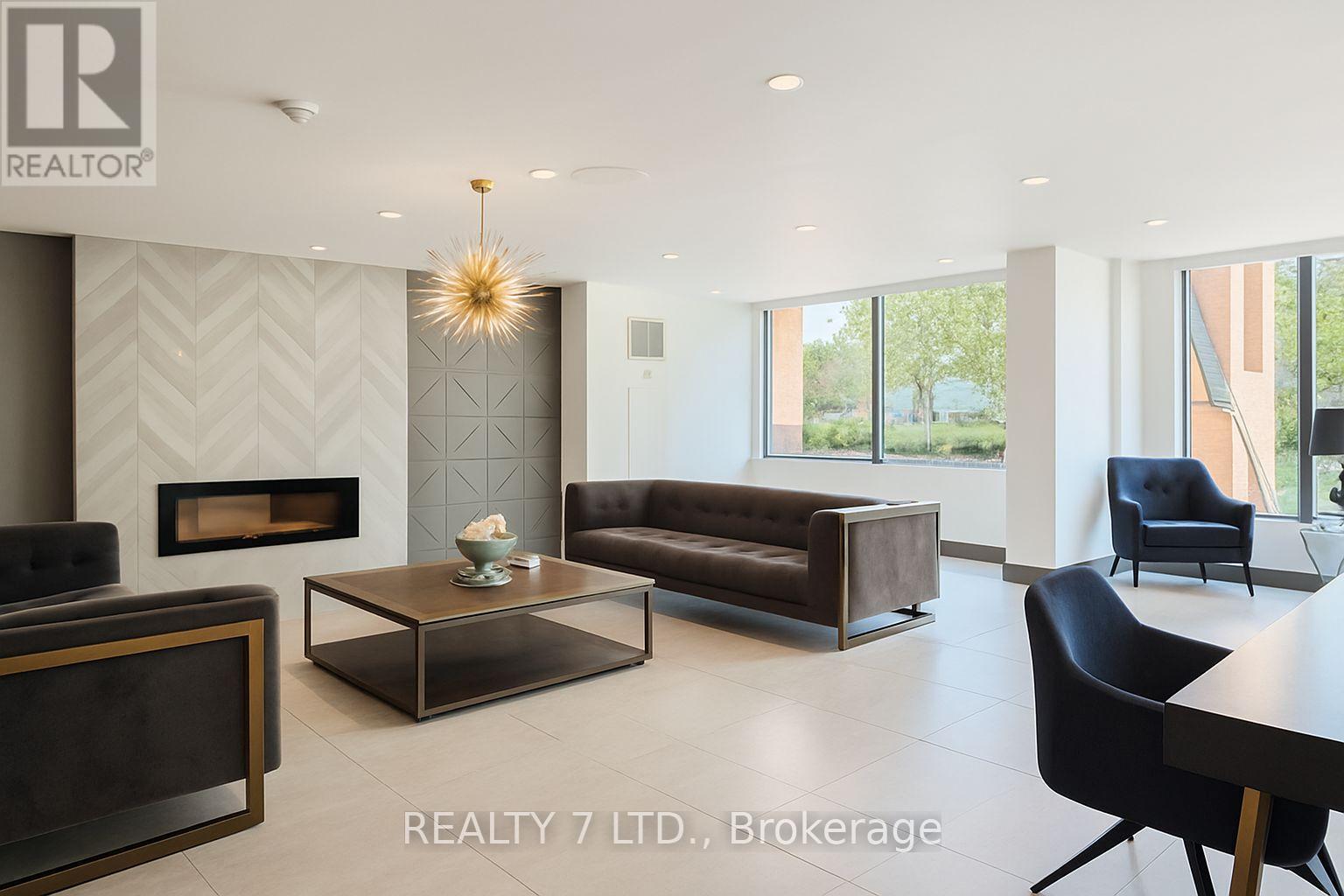 412 - 1270 Maple Crossing Boulevard, Burlington, ON - Indoor With Fireplace