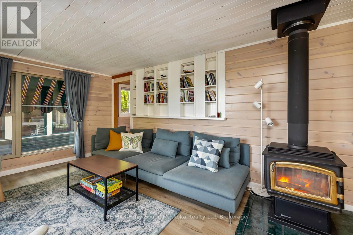 78 Captain Estates Road, Whitestone (Hagerman), ON - Indoor Photo Showing Living Room With Fireplace