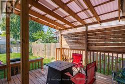 Deck with view of back yard. -
