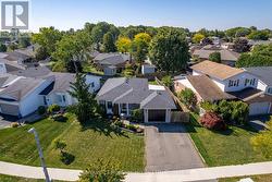 Bungalow with fenced back yard and car drive way. -