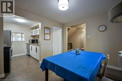 Playroom with baseboards and dark wood-type flooring -